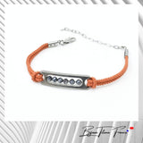 Bracelet titane fait en France et cordon couleur orrange pour femme  ∣ Bijoux Titane France®